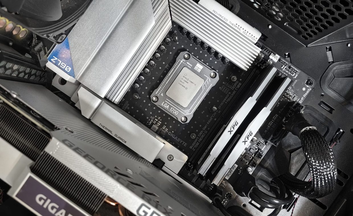 Interior view of a high-performance PC build featuring a Gigabyte motherboard and components.